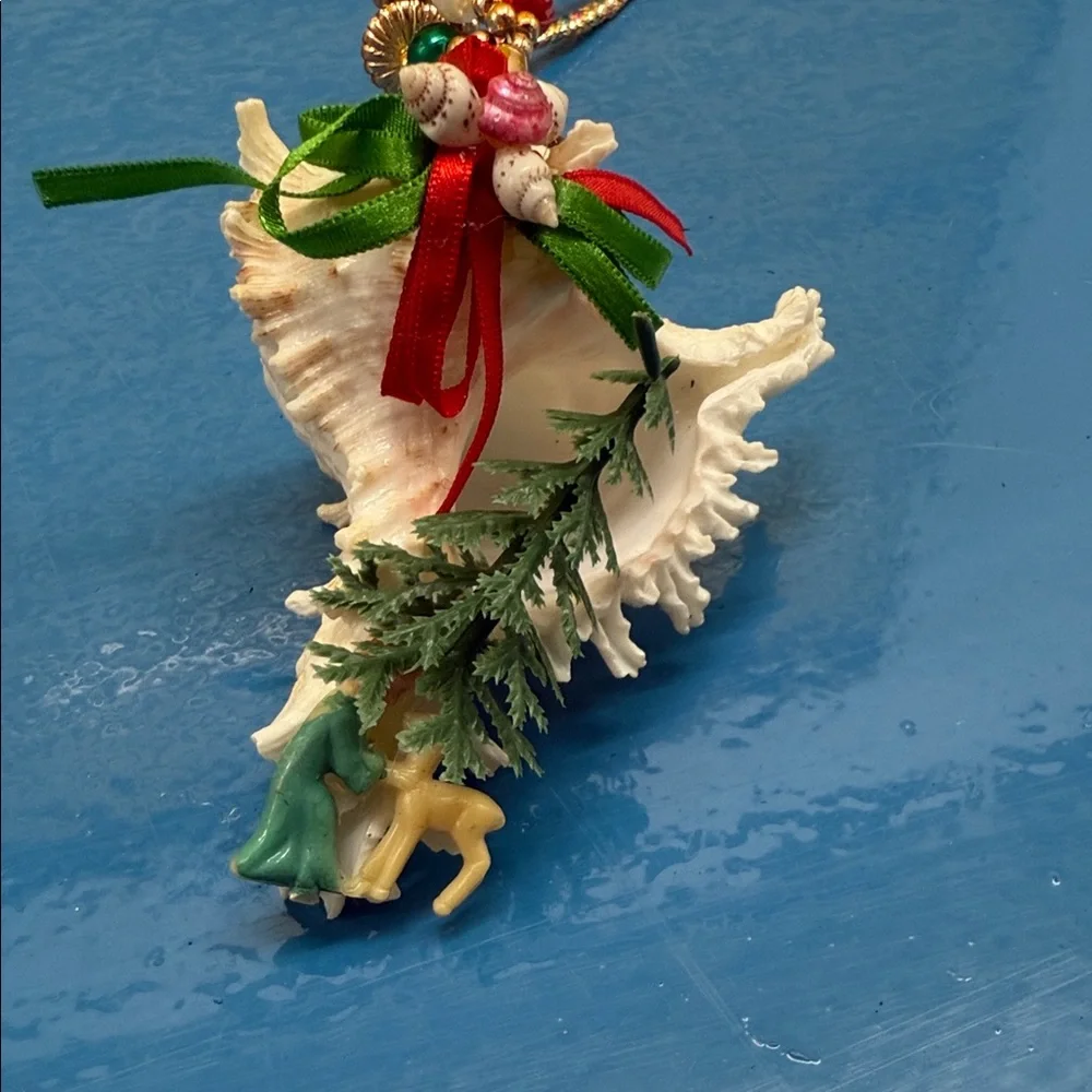 Elegant Shell Ornament with Pink and Green Accents